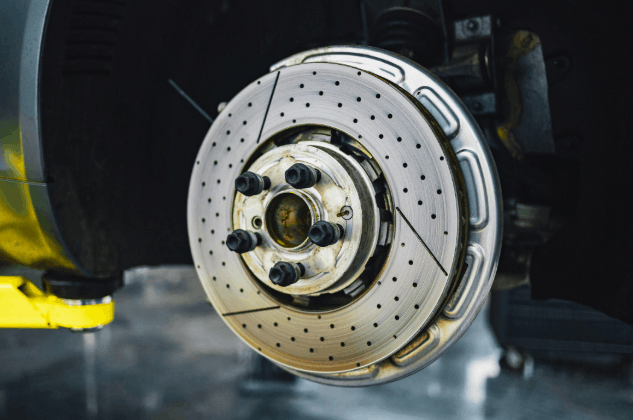 How should you use anti-lock brakes when you need to stop in an emergency