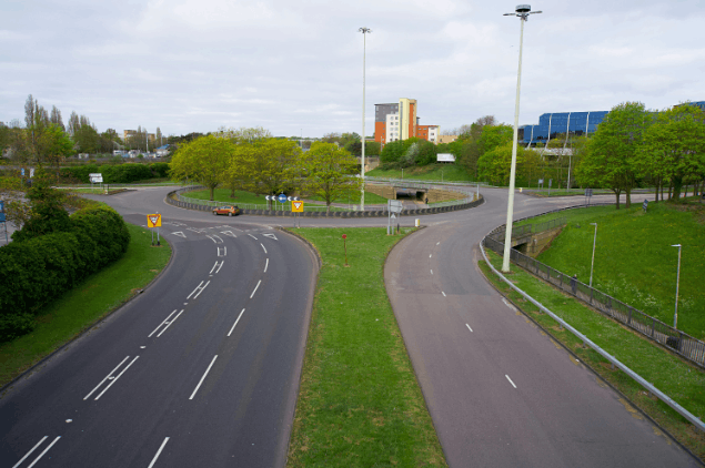 Where would you find green reflective studs on a motorway