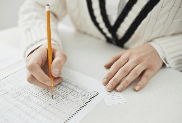 What are the steps to book a theory test with BSL support